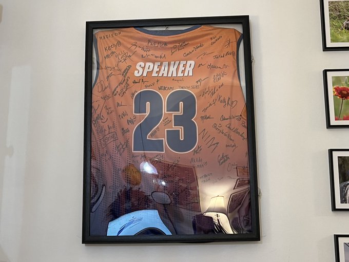 Orange and purple basketball jersey with the word Speaker and the number 23 and signatures from WordCamp Phoenix attendees.
