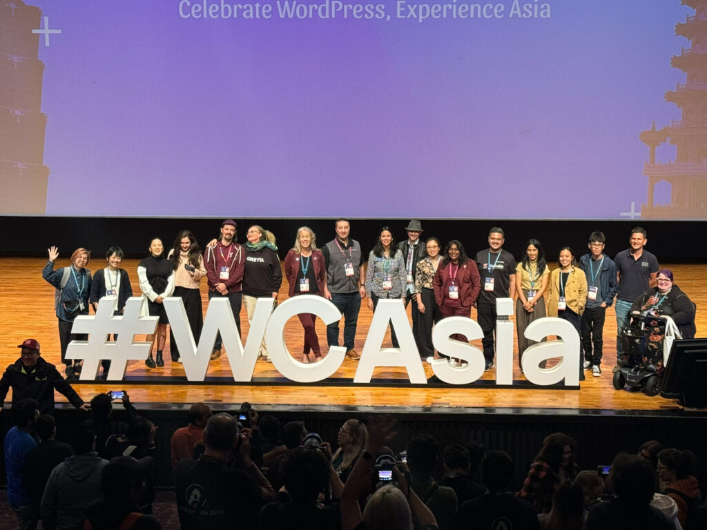 Speakers on the stage for a final photo during WordCamp Asia's closing remarks