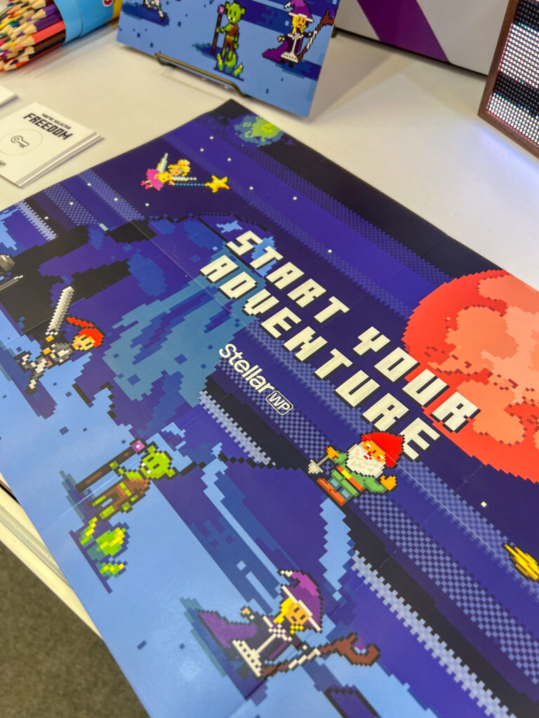 Our 8-bit "choose your adventure" poster that explains about the StellarWP brands on the reverse side.