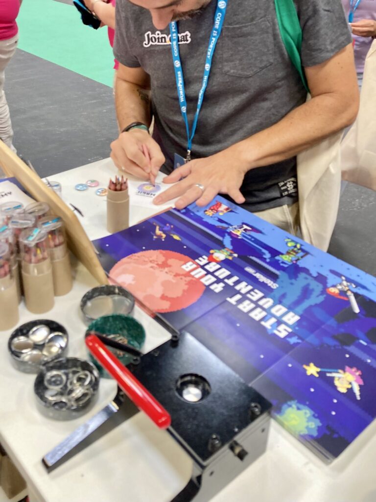 Attendees at the StellarWP booth at WCEU
