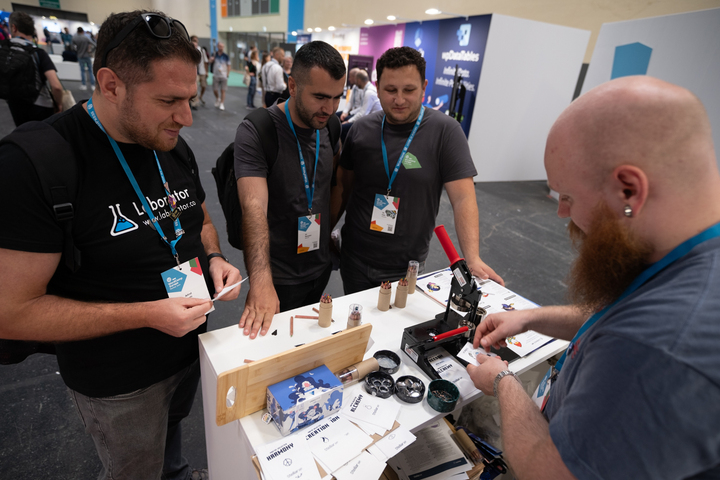 Attendees at the StellarWP booth at WCEU