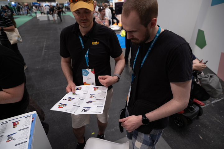 Attendees at the StellarWP booth at WCEU