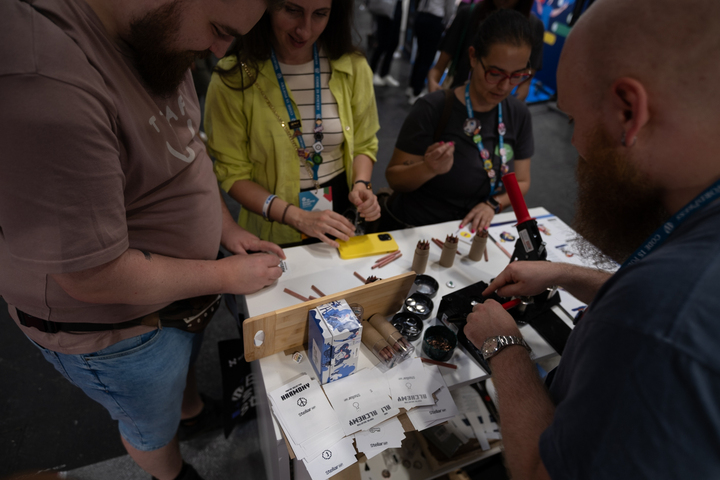 Attendees at the StellarWP booth at WCEU